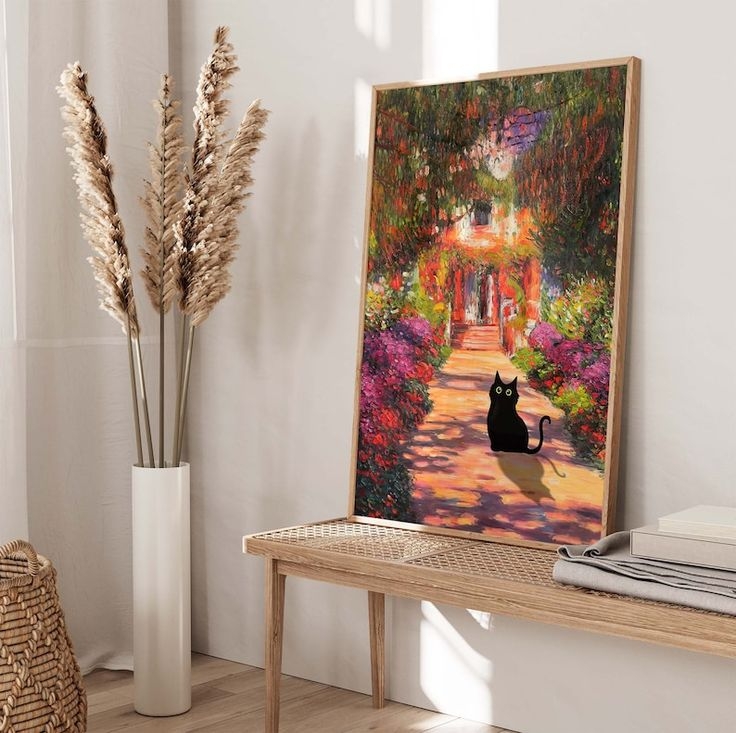 A Black Cat Sitting On Top Of A Wooden Table Next To A Vase Filled With 